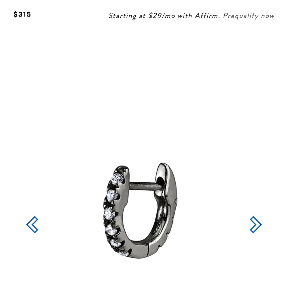 Two rhodium gold and diamond tiny hoops by Last Line LA. Similar to Maria Tash.